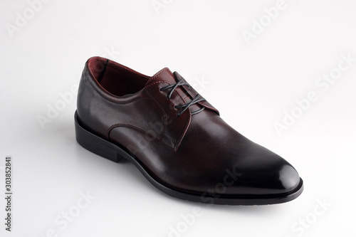 Black men leather shoe with shoelaces on white background