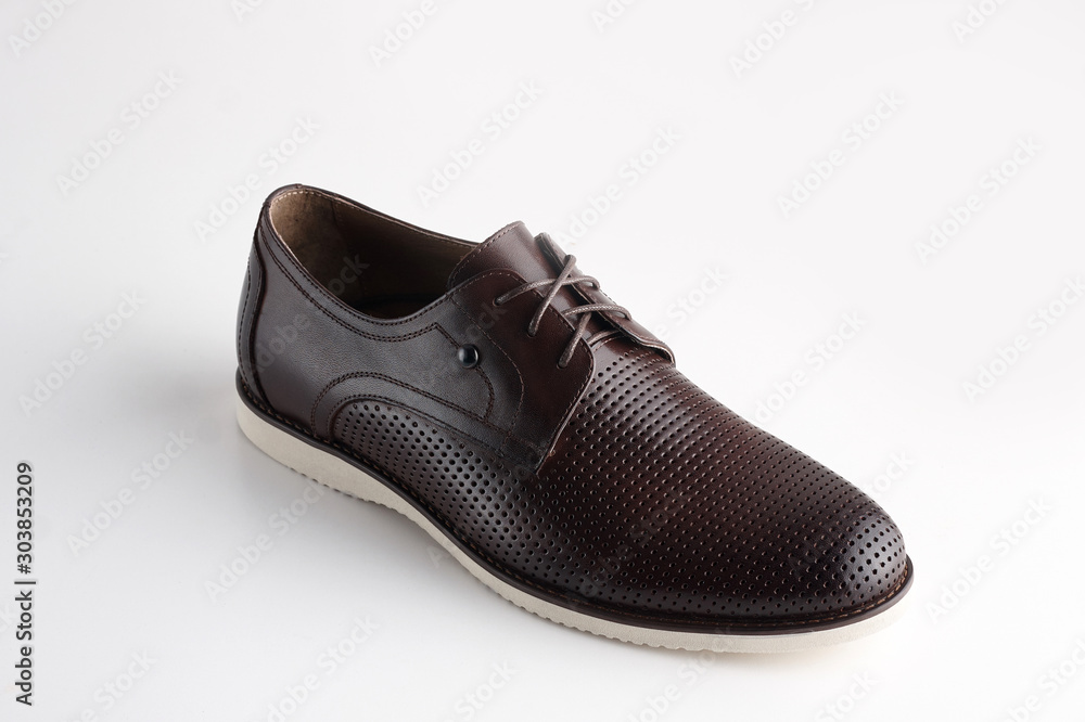 Brown men leather shoe with shoelaces on white background