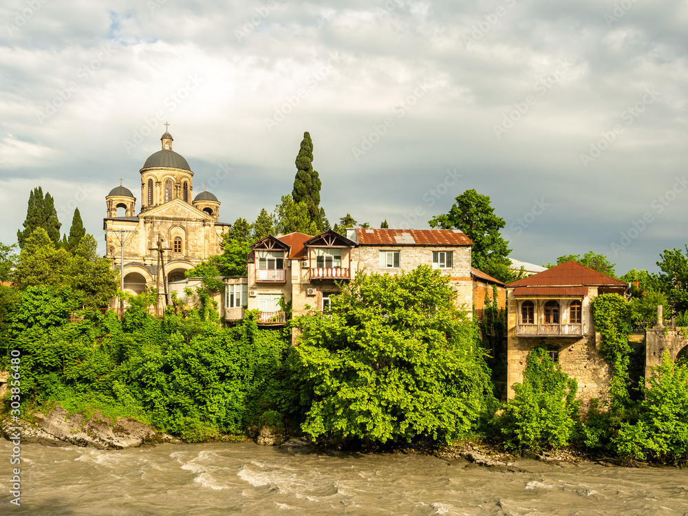 Kutaisi buildings at the bank of Rioni river in the evening.