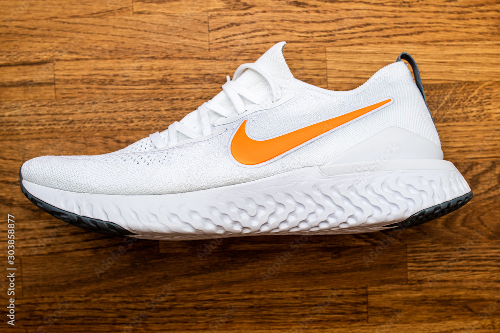 Paris, France - Jul 8, 2019: View from above of new Nike Epic React flyknit  running professional shoe with orange Nike Swoosh logotype Stock Photo |  Adobe Stock