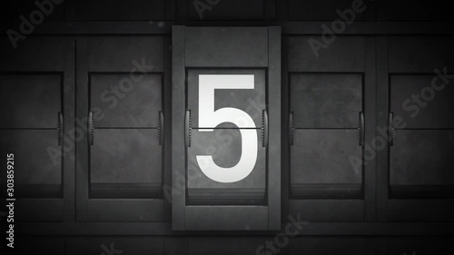 Countdown With Airport Split Flap Letters/ 4k animation of a countdown background from 9 to 0 with airport style split flap numbers showing and grain and texture overlays photo