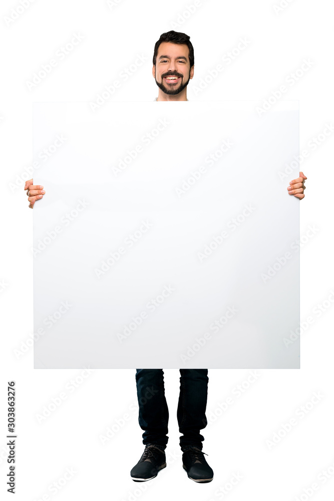 Handsome man with beard holding an empty placard Handsome man with beard holding an empty placard