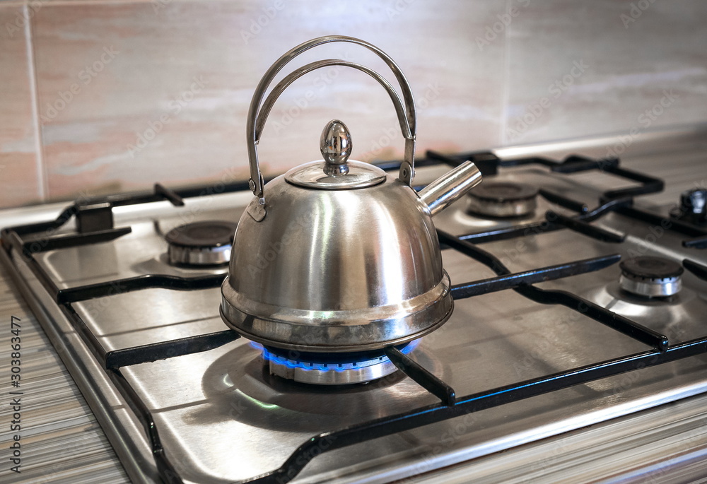 steel kettle on gas, boiling stove stainless iron tea