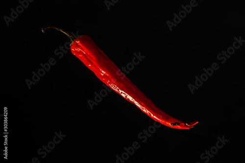 Red hot chili peppers on a dark background