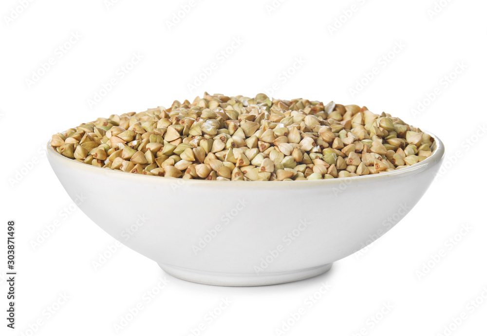 Uncooked green buckwheat grains in bowl isolated on white Uncooked green buckwheat grains in bowl isolated on white