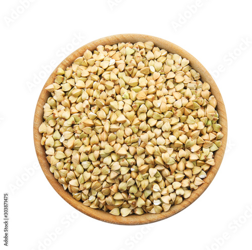 Uncooked green buckwheat grains in bowl isolated on white, top view