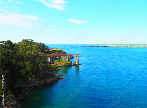 View of the wooden bridge (named O Cargadeiro) over the river in Ribadeo, Lugo, Spain photo