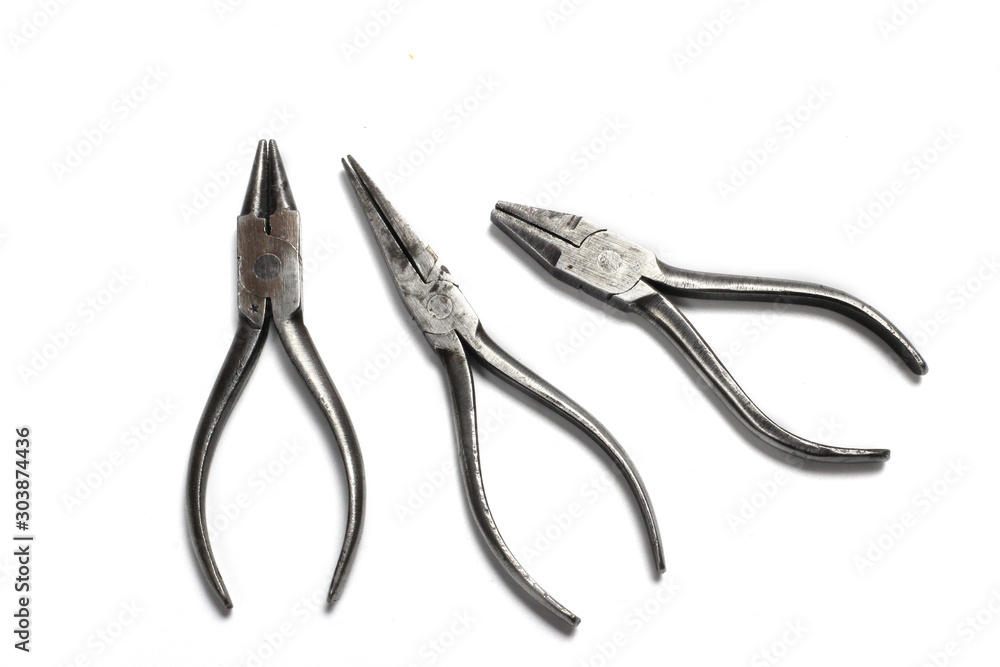 Old metall pliers on a white background, isolated Old metall pliers on a white background, isolated