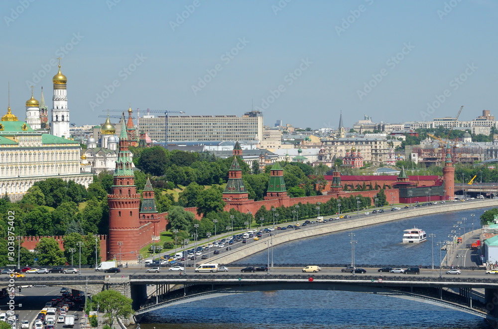 Summer view of the Big Stone bridge, the Moscow Kremlin and the Kremlin embankment. Moscow, Russia