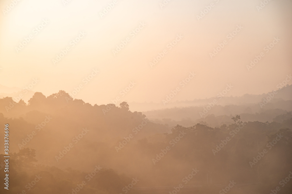 yellow bright multi layer mountain in morning view with mist