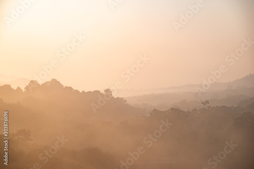 yellow bright multi layer mountain in morning view with mist