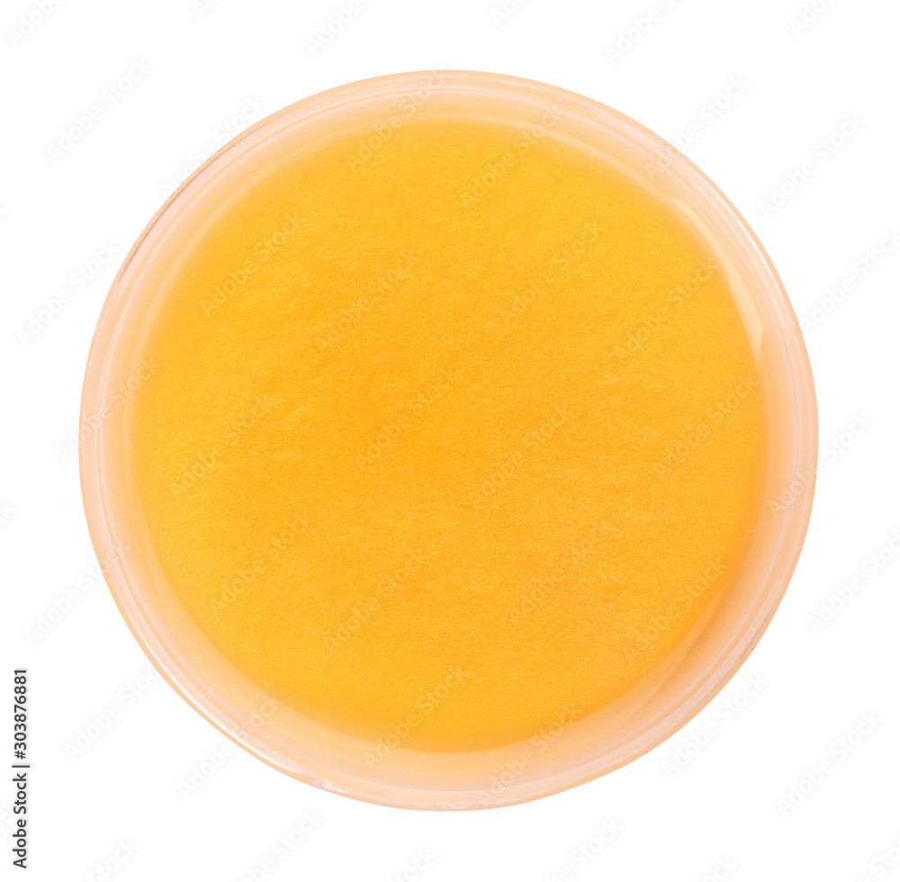 Orange slime in plastic container isolated on white, top view. Antistress toy Orange slime in plastic container isolated on white, top view. Antistress toy