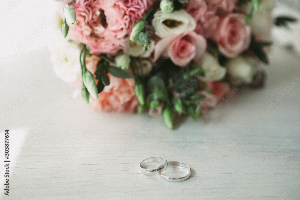 boho wedding banquet and wedding rings on wooden background boho wedding banquet and wedding rings on wooden background