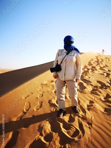 Photographer in Sahara desert, Morocco photo