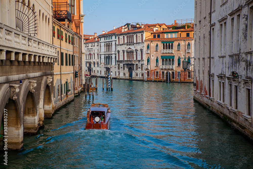 Venice canal with boats and old architecture