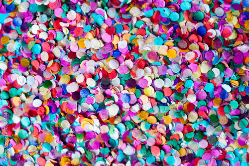 Multi-colored paper confetti Card, frame background close-up. Bright colorful festive decor Flat lay