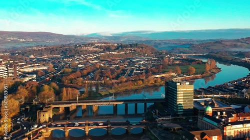 An aerial view at sunrise of Newport city centre, south wales United Kingdom, taken from the River Usk photo