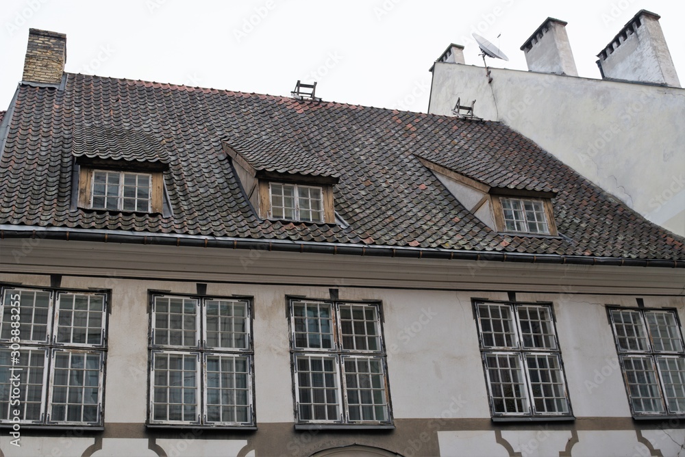 Riga, Latvia, November 2019. Fragment of the facade of a medieval historic house in the city center. Riga, Latvia, November 2019. Fragment of the facade of a medieval historic house in the city center.
