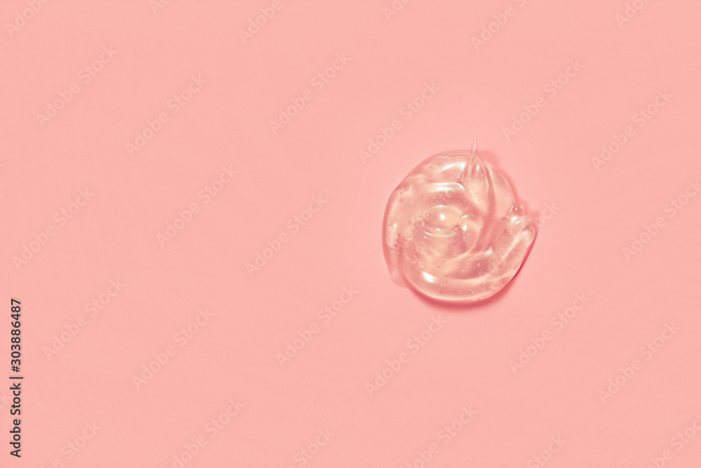 Cosmetic gel serum swatch sample drop on pink background