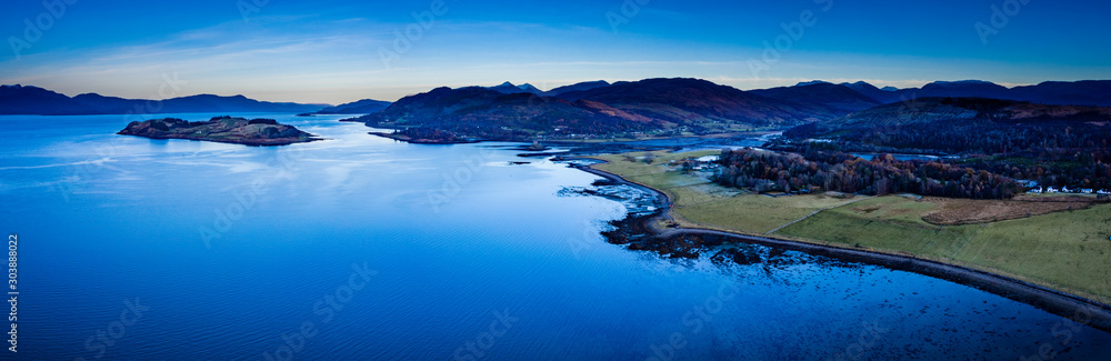 aerial panorama of loch linnhe on the west coast of scotland in the argyll region of the highlands near port appin and oban and fort william showing pink skies and calm blue water