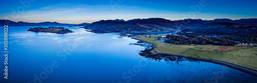 aerial panorama of loch linnhe on the west coast of scotland in the argyll region of the highlands near port appin and oban and fort william showing pink skies and calm blue water