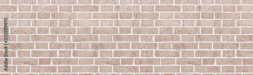 Wide light rough brick wall texture. Old masonry widescreen backdrop. Beige brickwork panoramic vintage background © JAYANNPO
