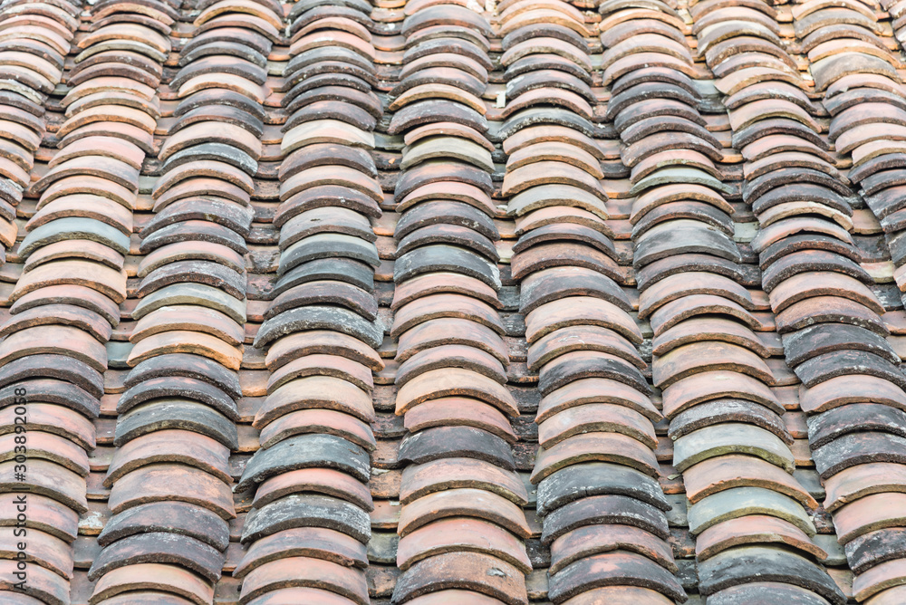 Colorful curved clay tiled roof from ancient house in the North Vietnam Colorful curved clay tiled roof from ancient house in the North Vietnam