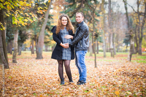 Happy pregnant couple  in autumn background © 2207918