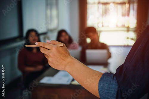 Group of young people meeting with digital tablet and laptop, students campus helps friend catching up and learning tutoring. People, learning, education and high school concept.