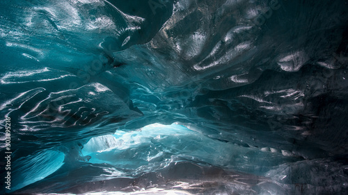 beautiful blue ice glacier cave grotto inside the mountain glacier Alibek, Dombay