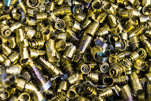 Metal shavings close-up multicolored, abstract background. Production waste.