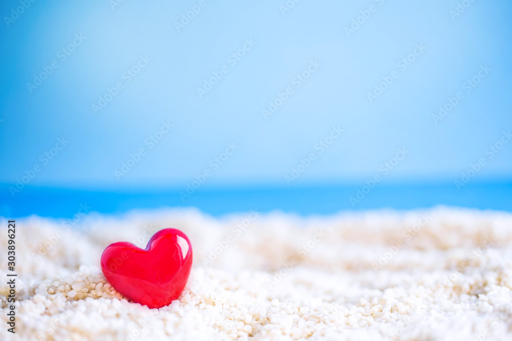 red Heart shape on white sand beach ,Image For Love Valentine Day or summer vacation Concept. red Heart shape on white sand beach ,Image For Love Valentine Day or summer vacation Concept.