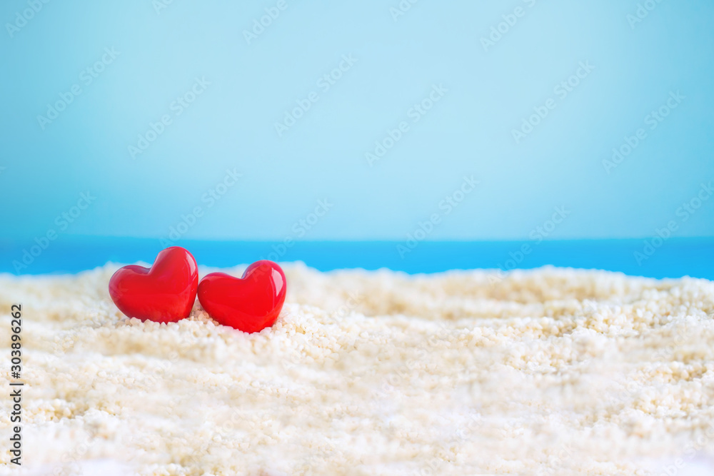 red Heart shape on white sand beach ,Image For Love Valentine Day or summer vacation Concept. red Heart shape on white sand beach ,Image For Love Valentine Day or summer vacation Concept.