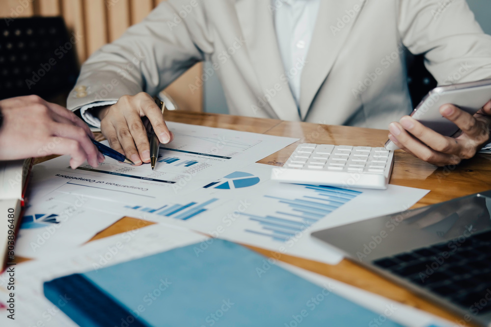 Fototapeta premium Asian business adviser meeting to analyze and discuss the situation on the financial report in the meeting room.Investment Consultant,Financial Consultant,Financial advisor and accounting concept