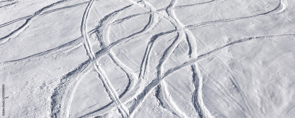 Fotografie Off-piste ski slope with trace from skis