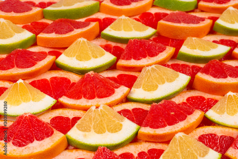 Pomelo and grapefruit slices background. Pomelo and grapefruit slices background.