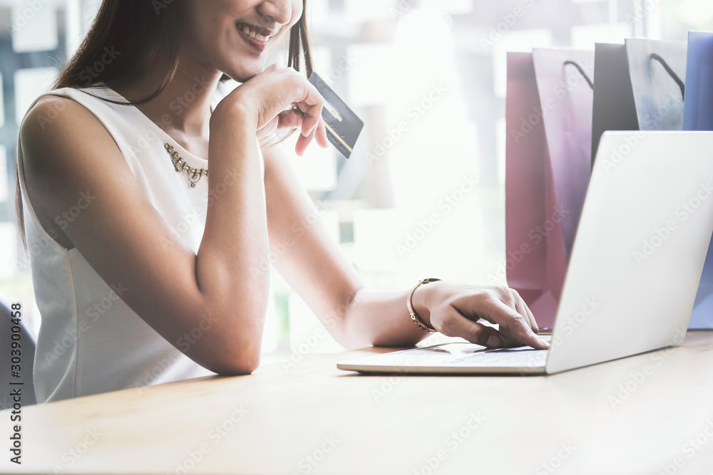 asian young business hands holding credit card and using laptop smart phone Online shopping Website,Article, Blog.Easy Ecommerce Website Shop Online by Smartphone.Online shopping concept asian young business hands holding credit card and using laptop smart phone Online shopping Website,Article, Blog.Easy Ecommerce Website Shop Online by Smartphone.Online shopping concept