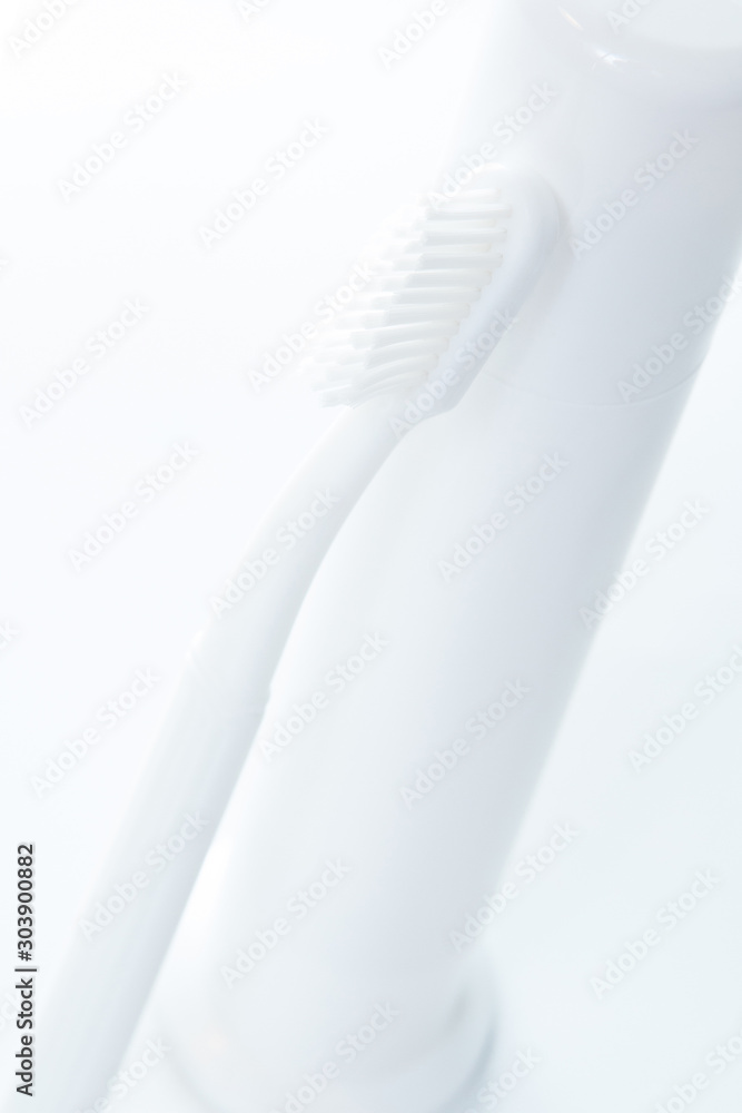 Toothpaste and toothbrush over white Toothpaste and toothbrush over white