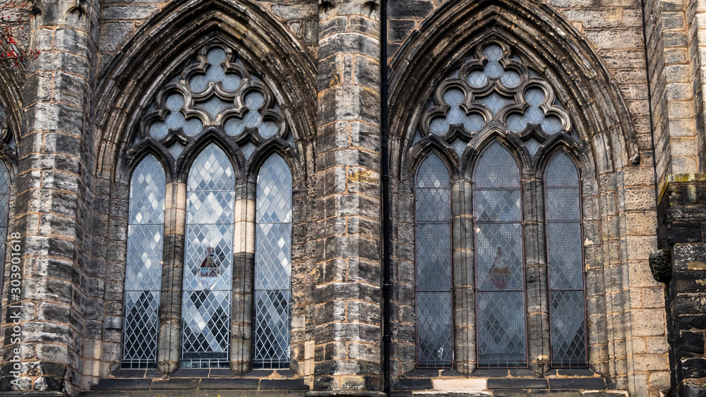 Two large windows belonging to a cathedral