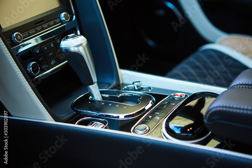 Detail of modern car interior, gear stick. © sarymsakov.com