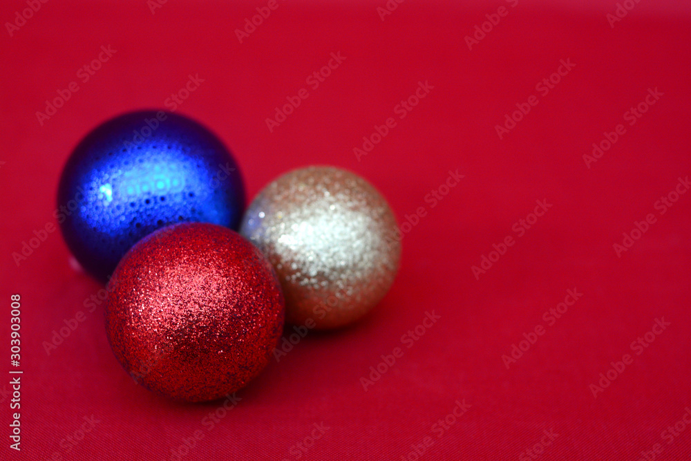 colorful christmas balls on red background colorful christmas balls on red background