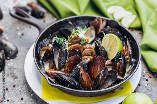 Baked Mediterranean mussels with creamy lime sauce.