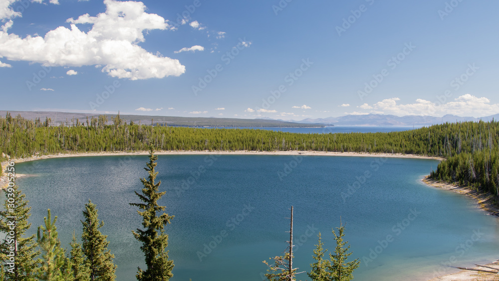 View of a lake surrounded by forest in Teton National Park, USA