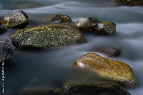 Big stones in mountain flowing stream