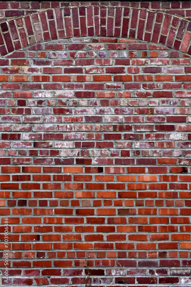 Fotografie Used bricks from different sources used to fill archway