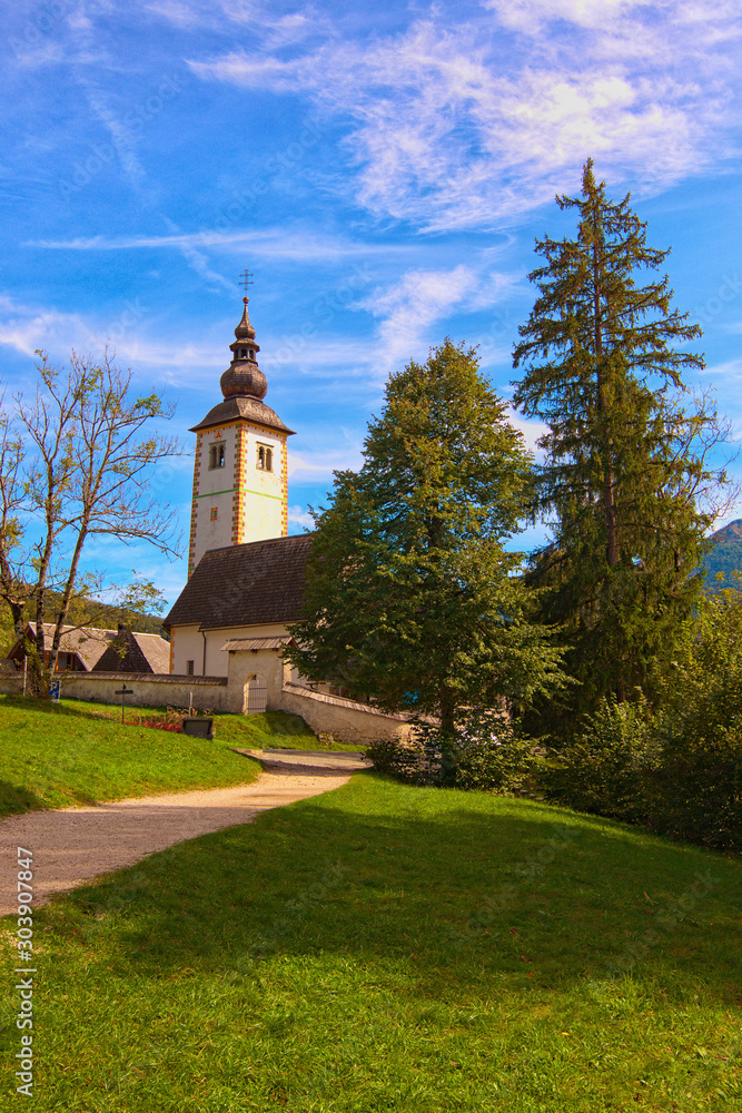 Beautiful landscape photo of Ancient John the Baptist Church near Bohinj lake. Popular travel destination in Slovenia. Triglav National Park, Slovenia