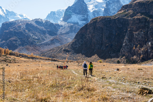 A team of tourists goes to the rocky mountains.