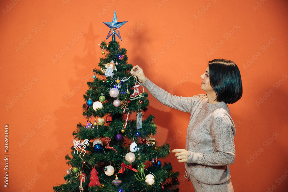 young girl near the Christmas tree getting ready for new year and christmas, festive cute portrait young girl near the Christmas tree getting ready for new year and christmas, festive cute portrait