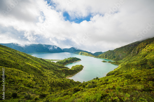 High Angle View of the Lake "Lagoa do Fogo" with turquoise water against cloudy sky, Sao Miguel Island, Azores Islands, Portugal © Tobias