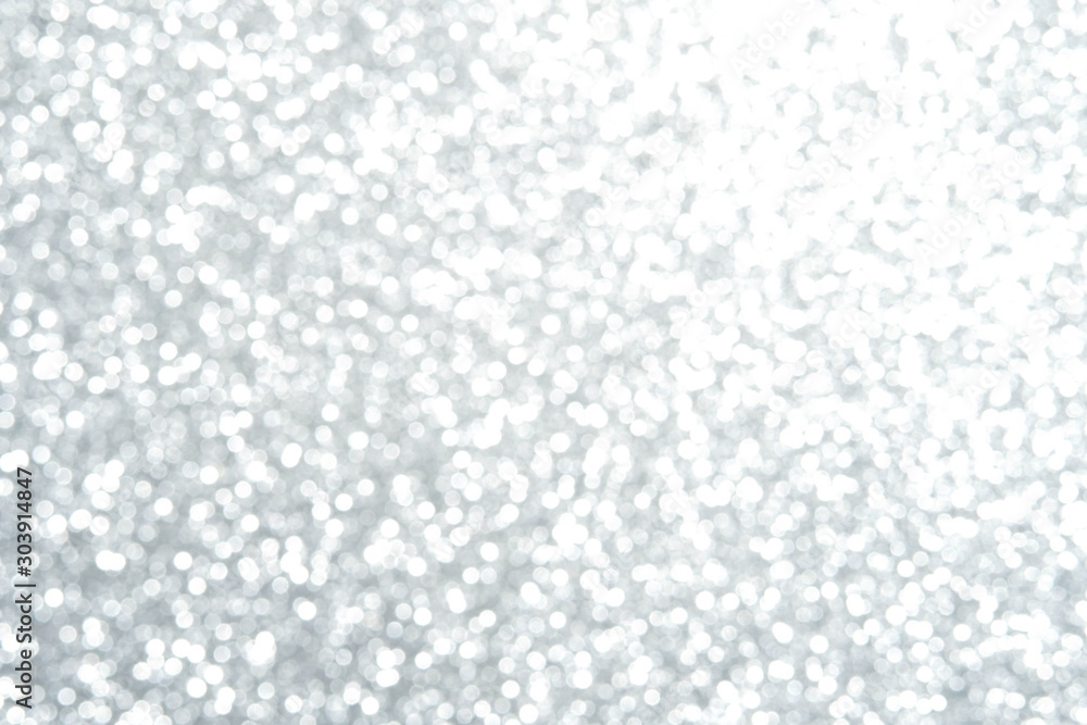 Silver Sparkling Lights Festive background with texture. Abstract Christmas twinkled bright bokeh defocused and Falling stars. Winter Card or invitation Silver Sparkling Lights Festive background with texture. Abstract Christmas twinkled bright bokeh defocused and Falling stars. Winter Card or invitation
